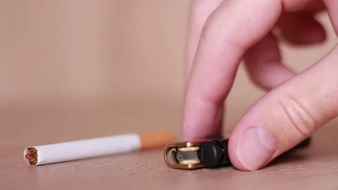 Taking cigarette and lighter from the table Stock Footage 81857161