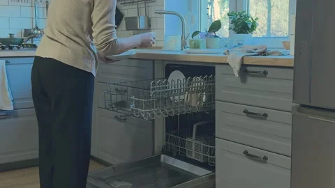 Taking Clean Plates And Cups Out Of Dishwasher Kitchen Chore Close View 库存影片 336450636