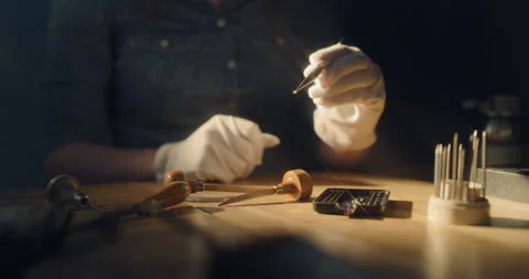 Taking a close look at a small diamond that gives spark-like flares Stock Footage 130967095