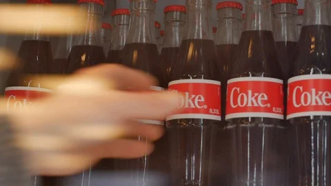 Taking CocaCola out of the Fridge Stock Footage 122243491