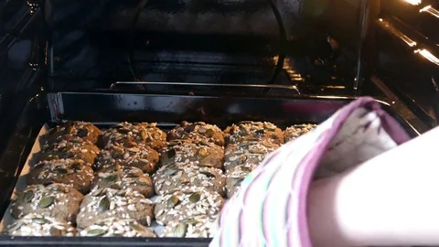 Taking cookies out of oven Stock Footage 73039983