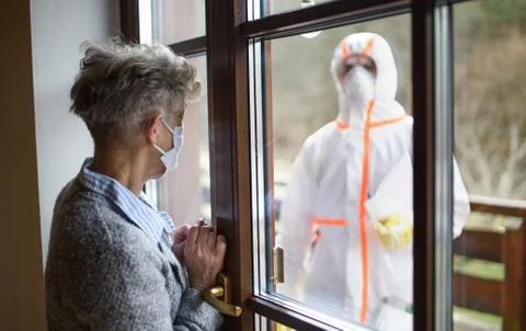 Taking corona virus test sample at home concept, senior woman in quarantine. Stock Photos