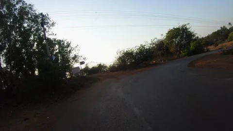 Taking a curve turn through the Roads of Goa, Living the Local Life in goa Stock Footage 141427153