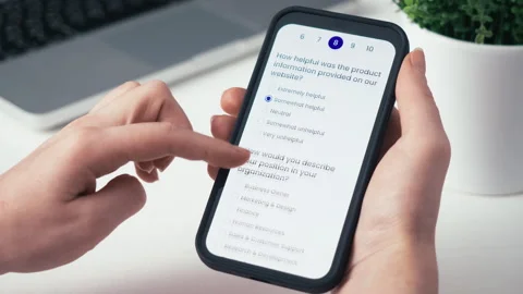 Taking a customer satisfaction survey online using a smartphone. Stock Footage 260403553