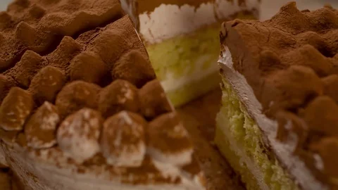 Taking cut Piece of Cake with paddle Closeup Slow motion track in camera Stock Footage 103256960