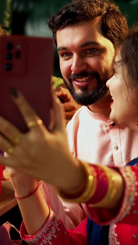 Taking Diwali selfie with sweets in decorated home in traditional festival Video stock 342384959