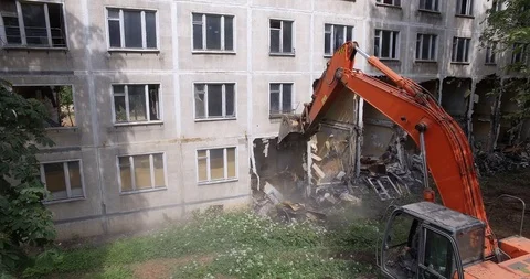 Taking down dilapidated apartment house, aerial view Stock Footage 124624444