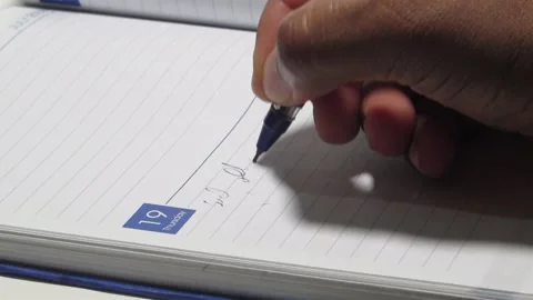 Taking down notes on a business diary Stock Footage 133544689