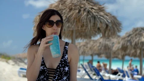 Taking a drink on the beach Stock-Footage 87170826