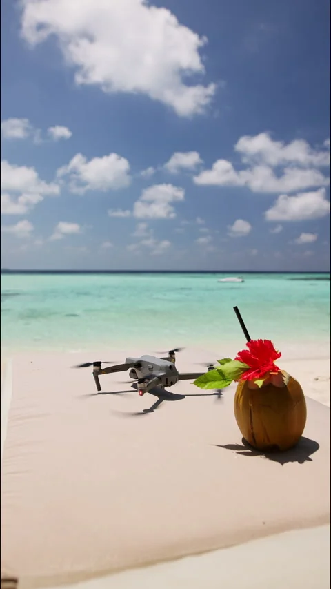 Taking off a drone from a beach in the Maldives. Holidays in the Maldives Stock Footage 260221517