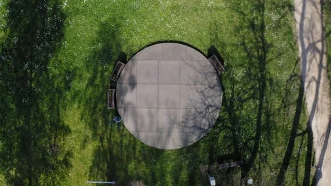 Taking off a drone from a circular place discovering on a meadow and a Stock-Footage 107506747