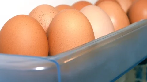 Taking an egg from inside the fridge. Closeup. Stock Footage 108563720