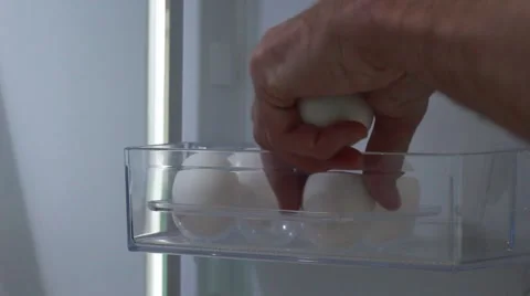 Taking eggs from a fridge Vídeo Stock 63454355