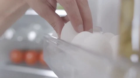 Taking eggs from fridge in slow motion Stock Footage 73597657