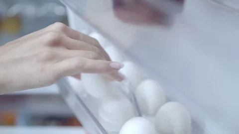 Taking eggs from fridge in slow motion Stock Footage 73597675