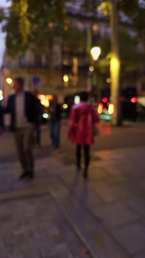 Taking an Evening Stroll Through a Bustling City with Brightly Illuminated Stock Footage 318557088