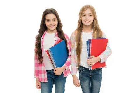 Taking extra classes. Happy to be students. Girls with school textbooks white Stock Photos