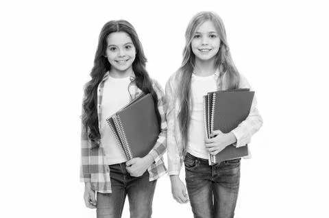 Taking extra classes. Happy to be students. Girls with school textbooks white Stock Photos