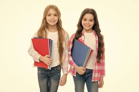 Taking extra classes. Happy to be students. Girls with school textbooks white Stock Photos