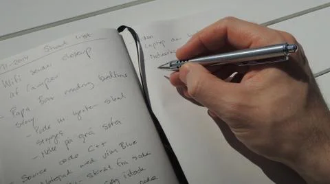 Taking a few notes in my personal idea journal Stock Photos
