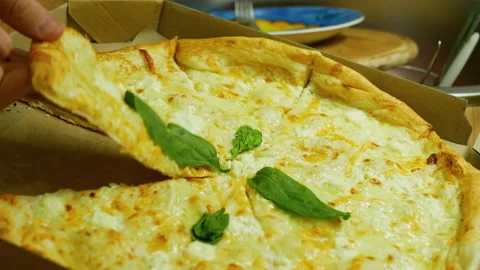 Taking the first piece of four cheese picca Stock Footage 168942840