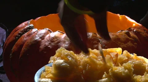 Taking the flesh out of the pumpkin Stock Footage