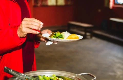 Taking food from Buffet Stock Photos