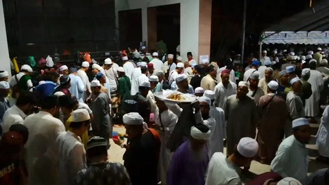 Taking food for dinner in mosque Stock Footage 107465504