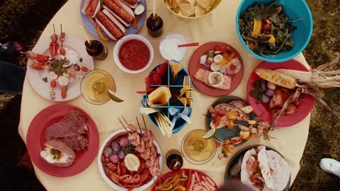 Taking Food From Picnic Table Stock Footage 71739361