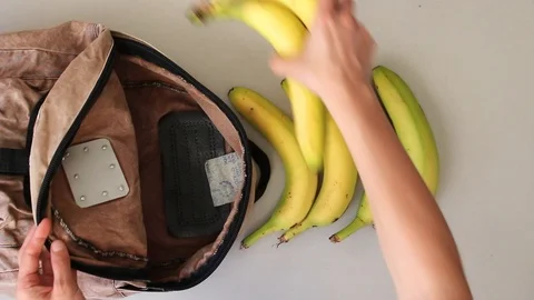Taking  fruits out from  old backpack after grocery shopping Stock Footage 105585727