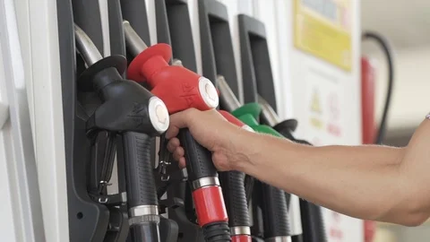Taking a fuel pump to refill the car, stock video Stock Footage 96591888