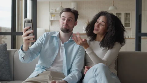 Taking Fun Selfie Together While Video Chatting On Couch At Home Stock Footage 311259765