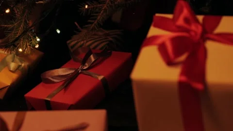 Taking  gift under christmas tree. Beautiful presents under the Christmas  Video stock 142138789