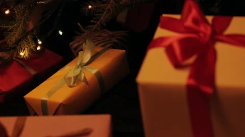 Taking  gift under christmas tree. Beautiful presents under the Christmas  Video stock 142138798