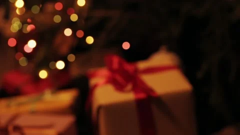 Taking  gift under christmas tree. Beautiful presents under the Christmas  Video stock 142138806