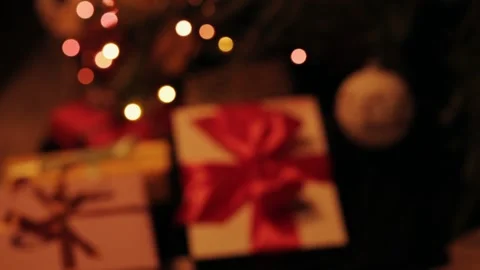 Taking  gift under christmas tree. Beautiful presents under the Christmas  Video stock 142138811