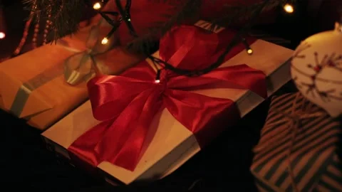 Taking  gift under christmas tree. Beautiful presents under the Christmas  Video stock 142138813
