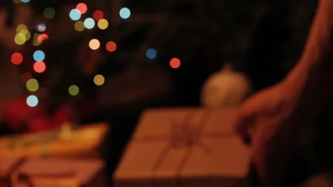 Taking  gift under christmas tree. Beautiful presents under the Christmas  Video stock 142138814