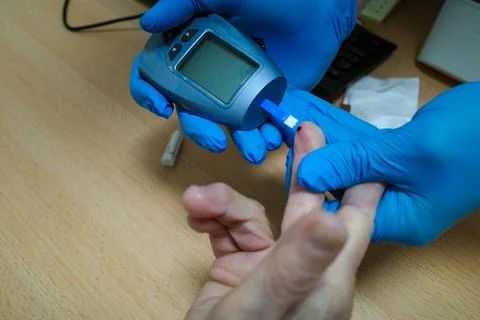 Taking glucose readings Stock Photos