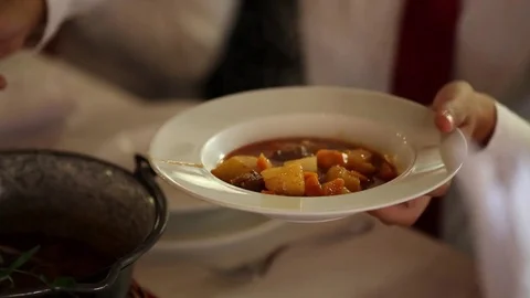 Taking goulash soup Stock Footage 72121466