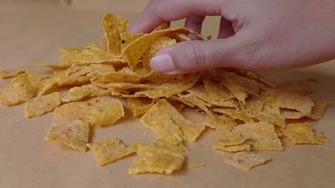 Taking a hand of nachos on the brown table Stock Footage 151027505