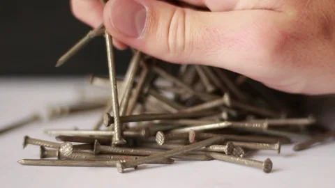 Taking handful of nails 動画素材 75827218