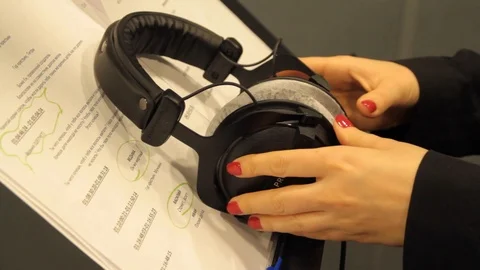 Taking  Headphones in the recording studio Stock Footage 125033528