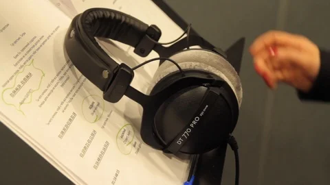 Taking  Headphones in the recording studio Stock Footage 125033541