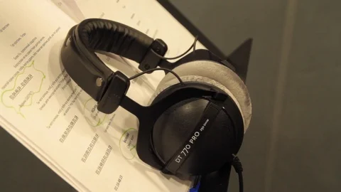 Taking  Headphones in the recording studio Stock Footage 125033590