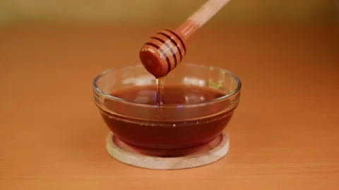 Taking Honey Slowmotion Stock-Footage 204852800
