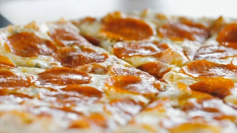 Taking hot pizza with melted stretching cheese, close-up. Stock Footage 121584069