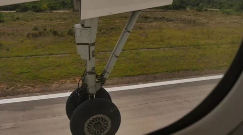 Taking off from inside plane passenger view landing gear  ready to take off Stockbeeldmateriaal 58599225