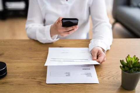 Taking Invoice Document Photo Using Phone Foto stock