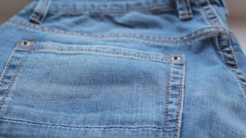 Taking jeans in store Video stock 73614389